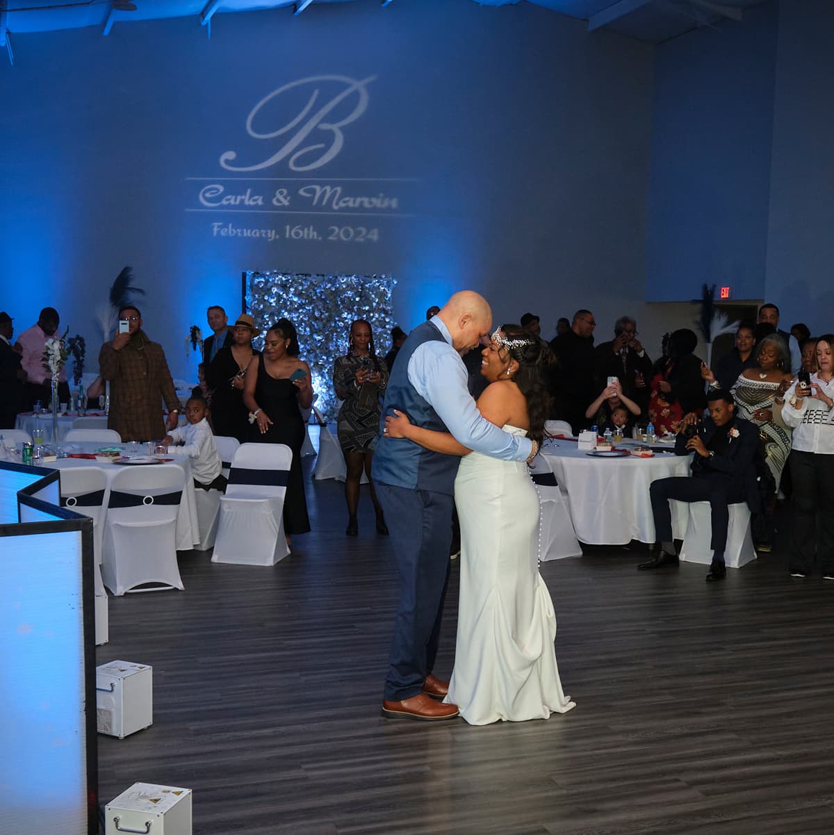 A newly married couple dancing at their reception